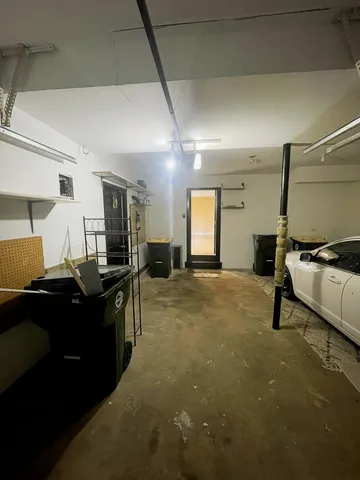 a kitchen with stainless steel appliances kitchen island granite countertop a refrigerator and a stove top oven