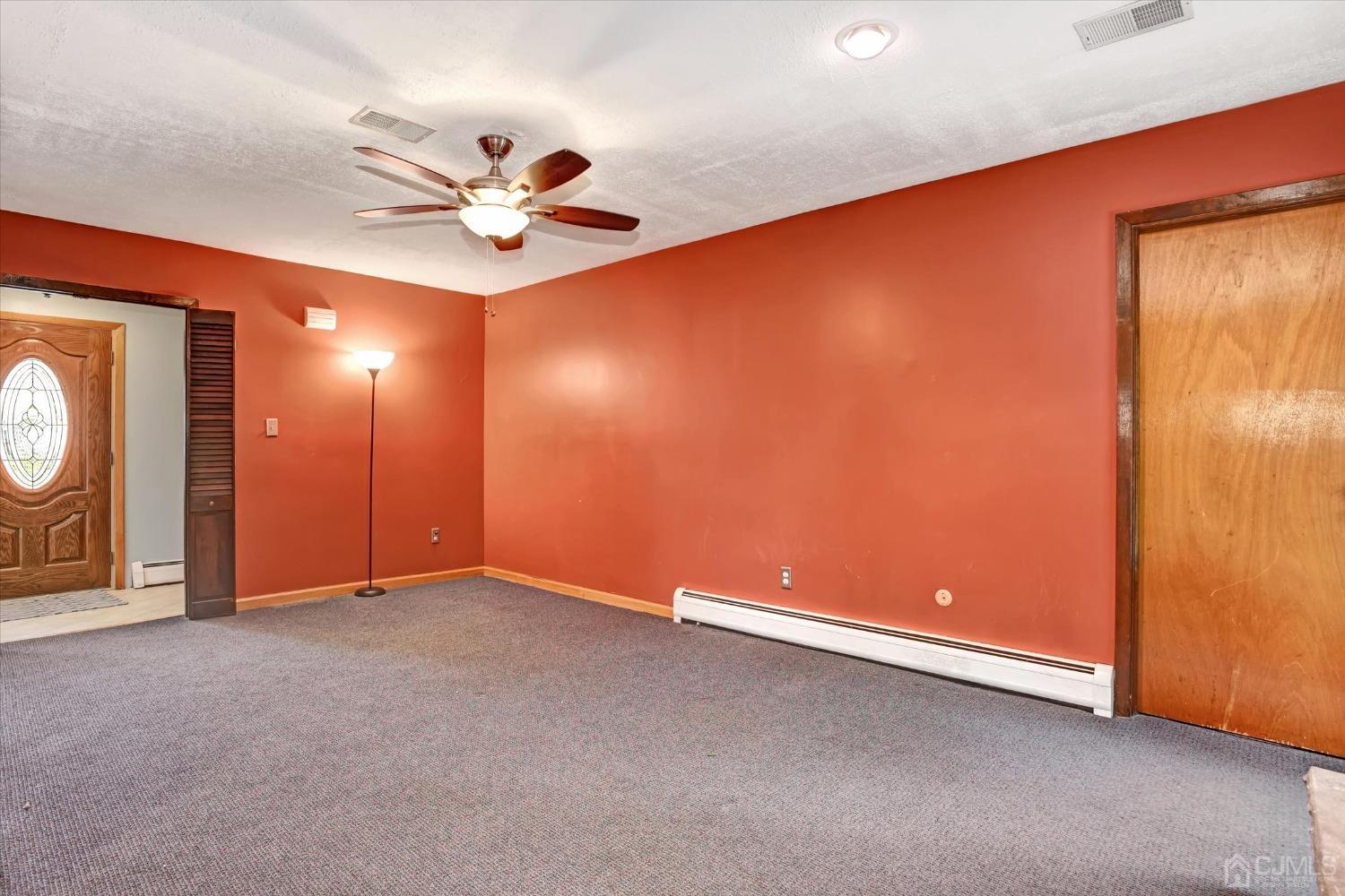 5 Weiss Drive Middlesex, NJ 08846 - Photo 15 of 24 an empty room with closet and fan