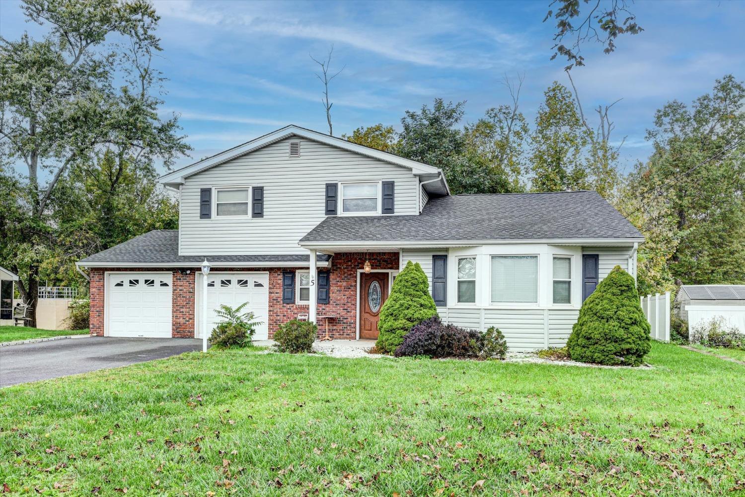 5 Weiss Drive Middlesex, NJ 08846 - Photo 18 of 24 a front view of a house with garden