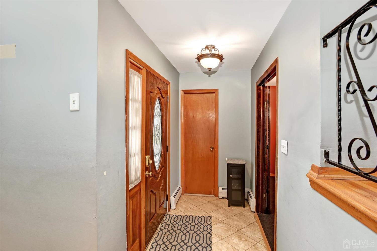 5 Weiss Drive Middlesex, NJ 08846 - Photo 22 of 24 a view of a hallway and a livingroom with furniture