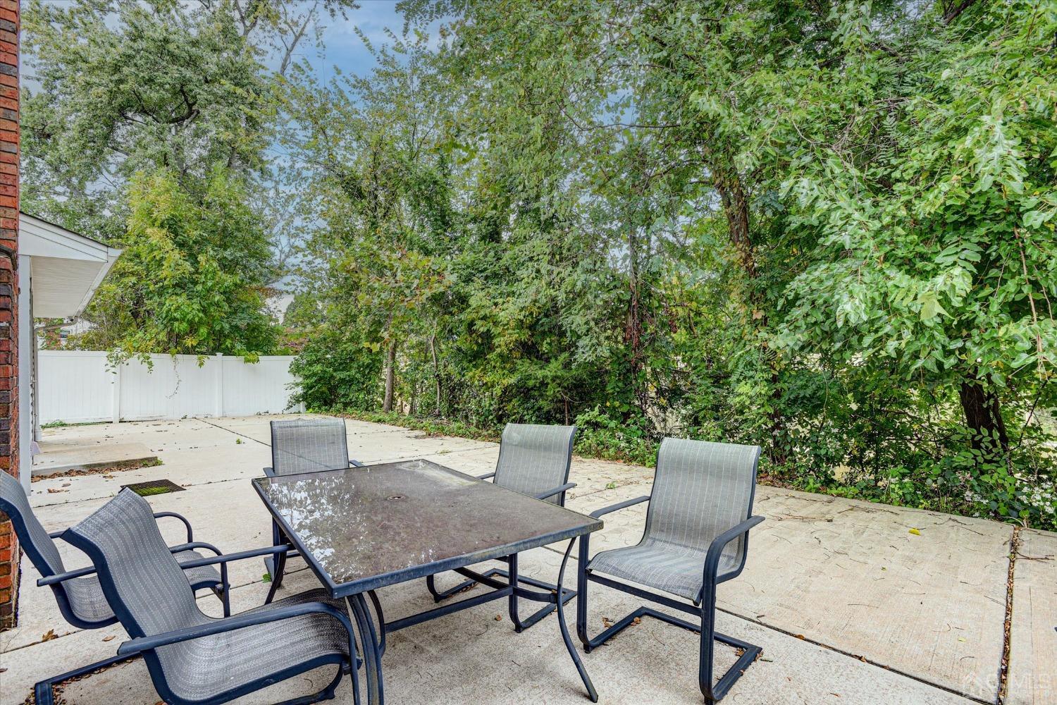5 Weiss Drive Middlesex, NJ 08846 - Photo 3 of 24 a view of a yard with a table and chairs