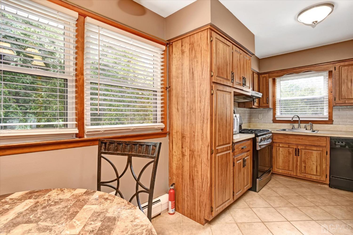 5 Weiss Drive Middlesex, NJ 08846 - Photo 6 of 24 a kitchen with stainless steel appliances granite countertop a refrigerator and a sink