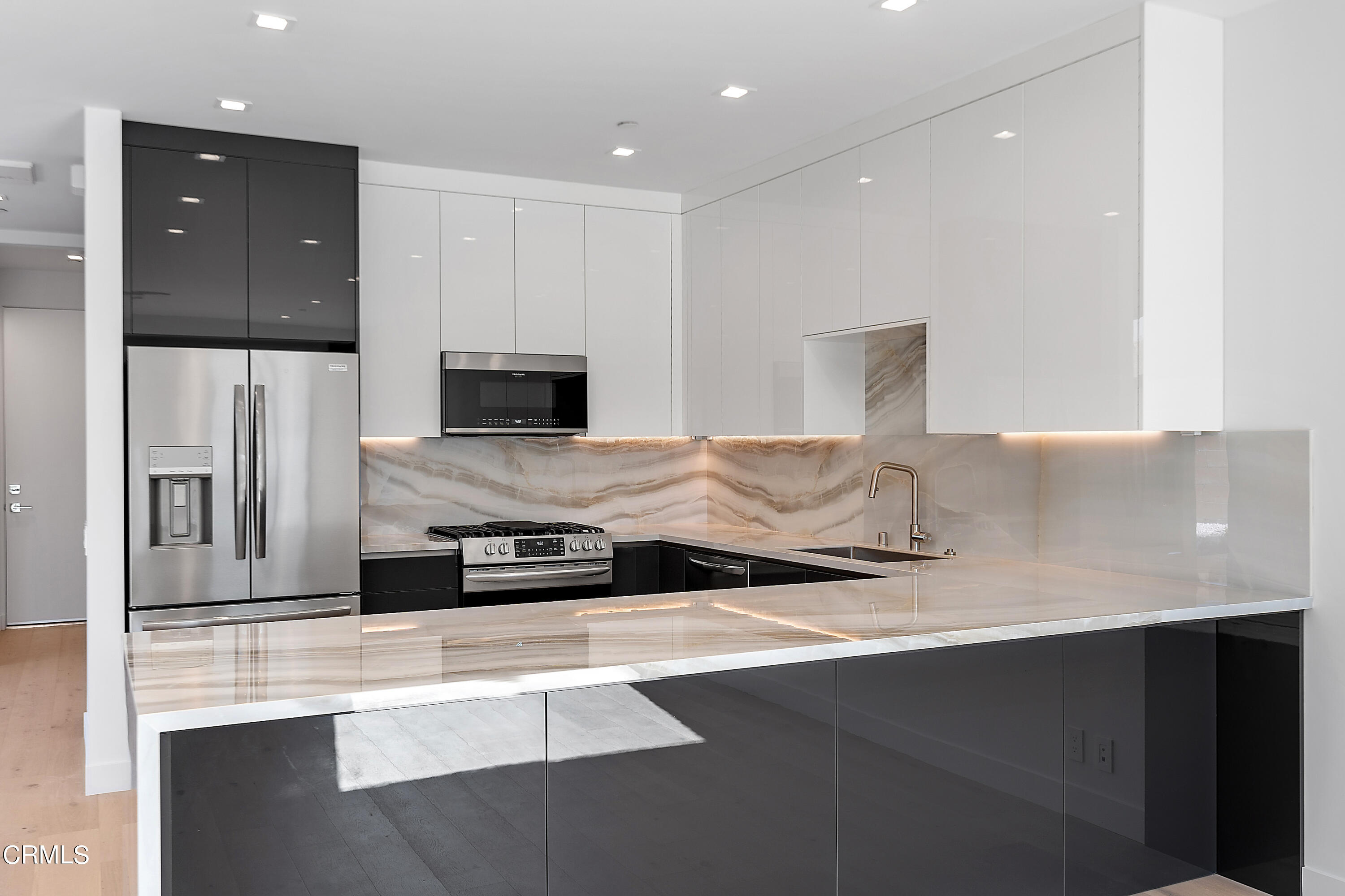 1001 Catamaran Street Oxnard, CA 93035 - Photo 18 of 37 a kitchen with stainless steel appliances a sink stove and refrigerator