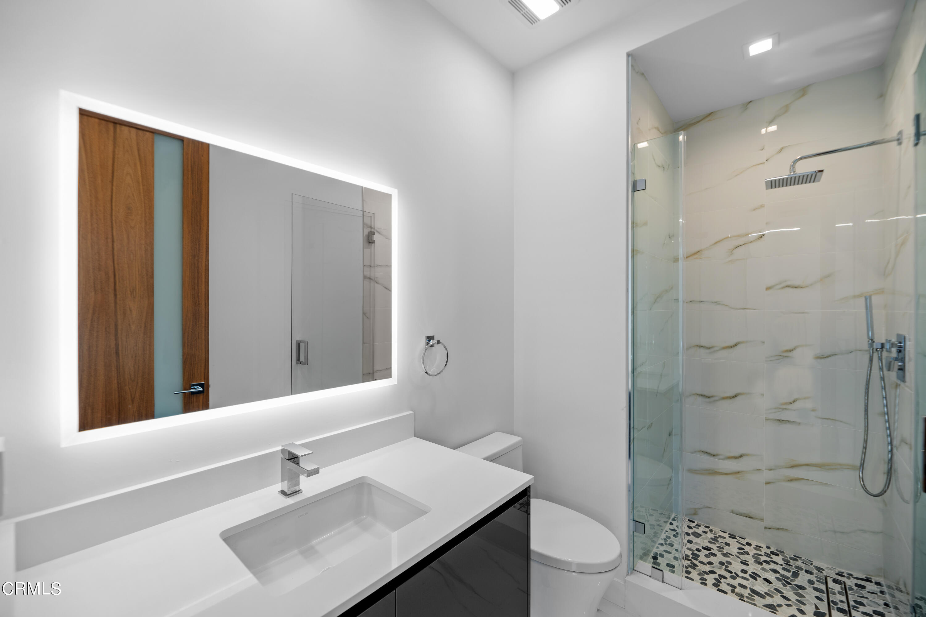 1001 Catamaran Street Oxnard, CA 93035 - Photo 23 of 37 a bathroom with a sink a toilet and shower