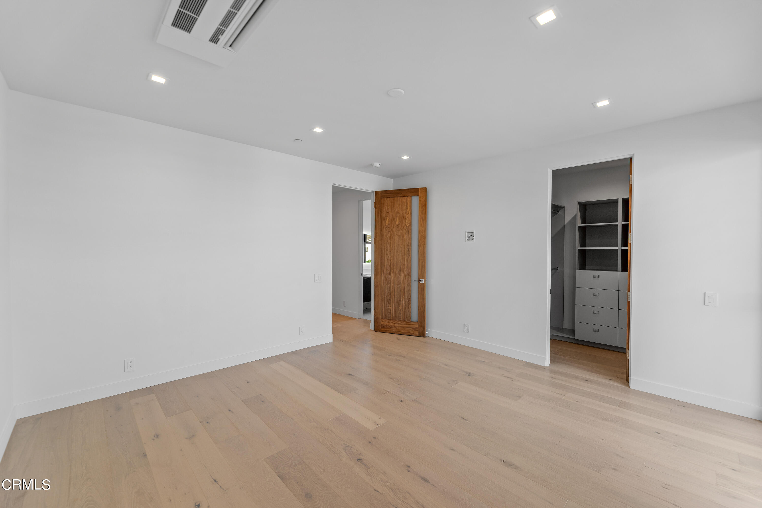 1001 Catamaran Street Oxnard, CA 93035 - Photo 26 of 37 an empty room with closet and a chandelier fan