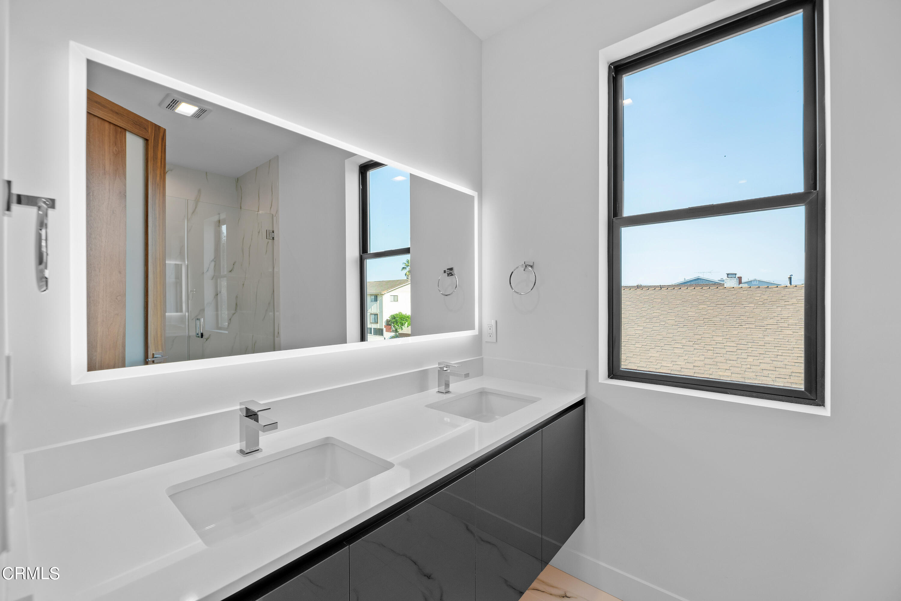 1001 Catamaran Street Oxnard, CA 93035 - Photo 30 of 37 a bathroom with a sink and a mirror