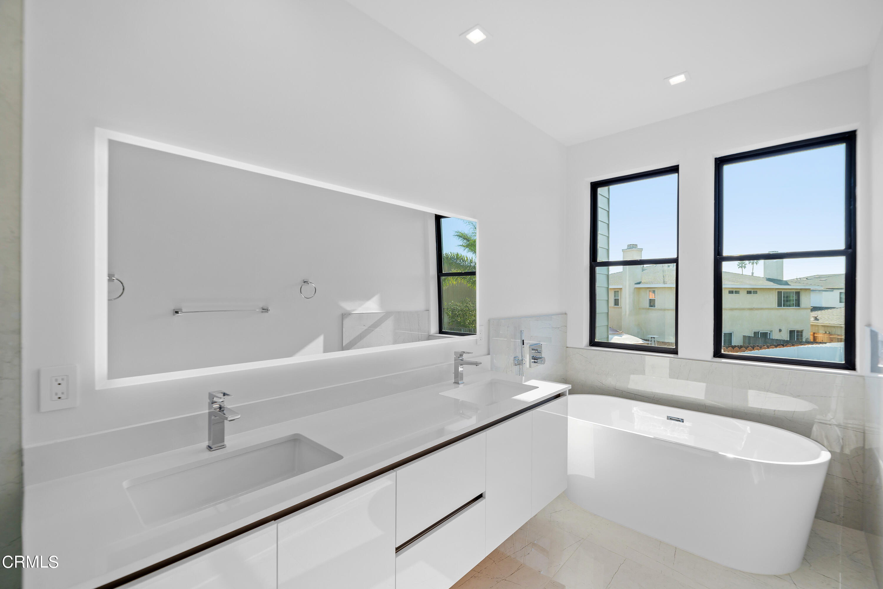 1001 Catamaran Street Oxnard, CA 93035 - Photo 35 of 37 a bathroom with a bathtub and a sink