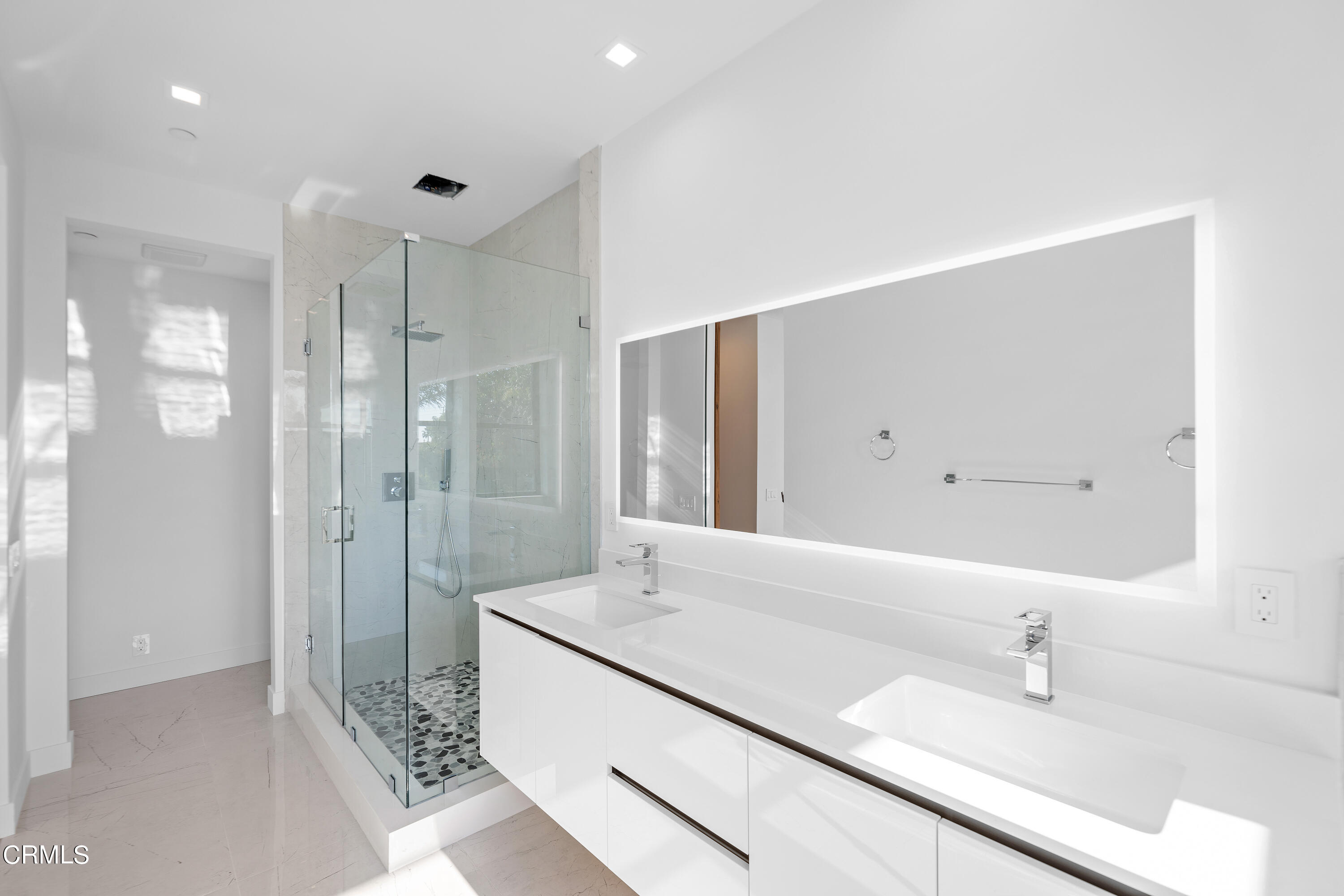 1001 Catamaran Street Oxnard, CA 93035 - Photo 37 of 37 a bathroom with a granite countertop sink mirror and double