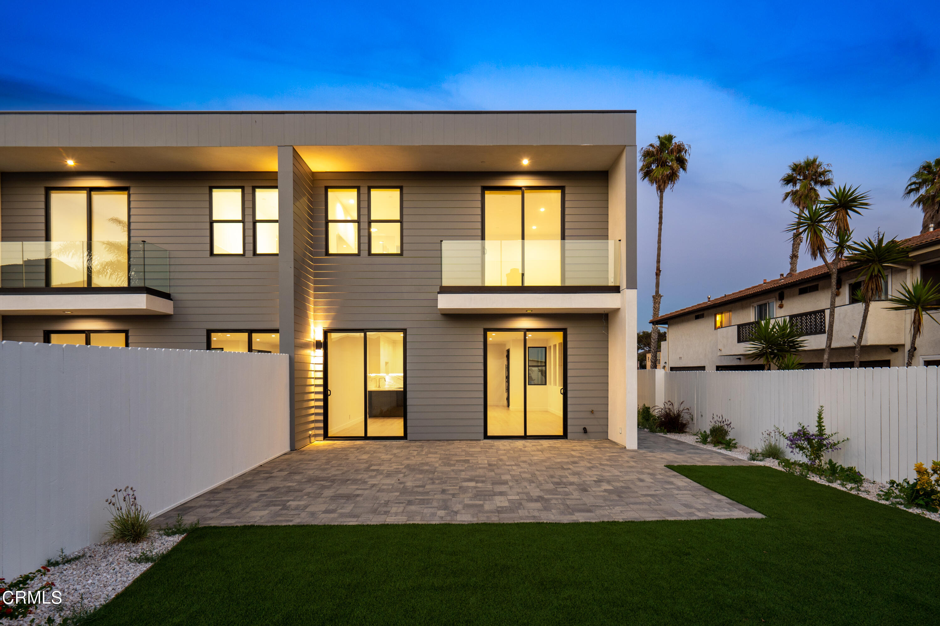1001 Catamaran Street Oxnard, CA 93035 - Photo 9 of 37 a front view of a house with a yard