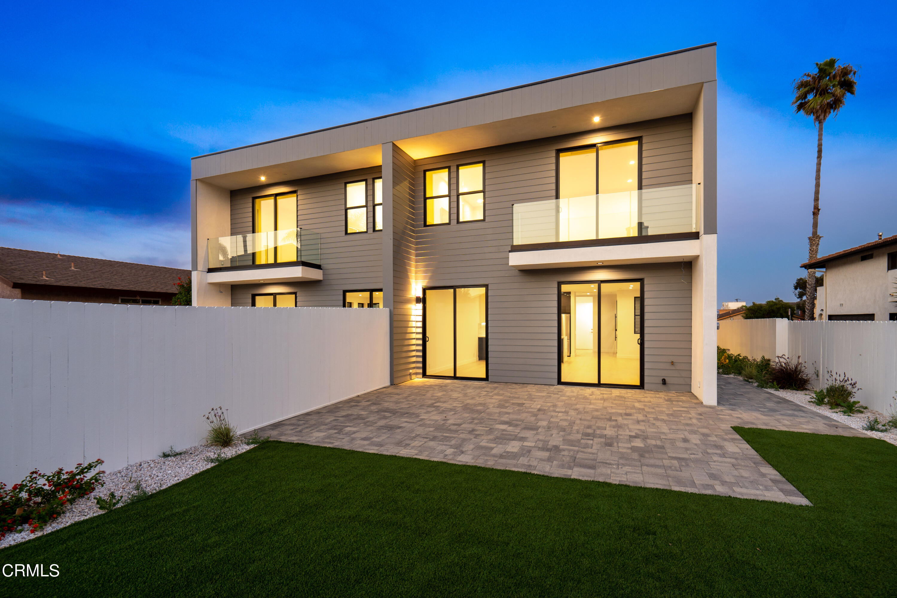 1001 Catamaran Street Oxnard, CA 93035 - Photo 10 of 37 a front view of a house with a yard