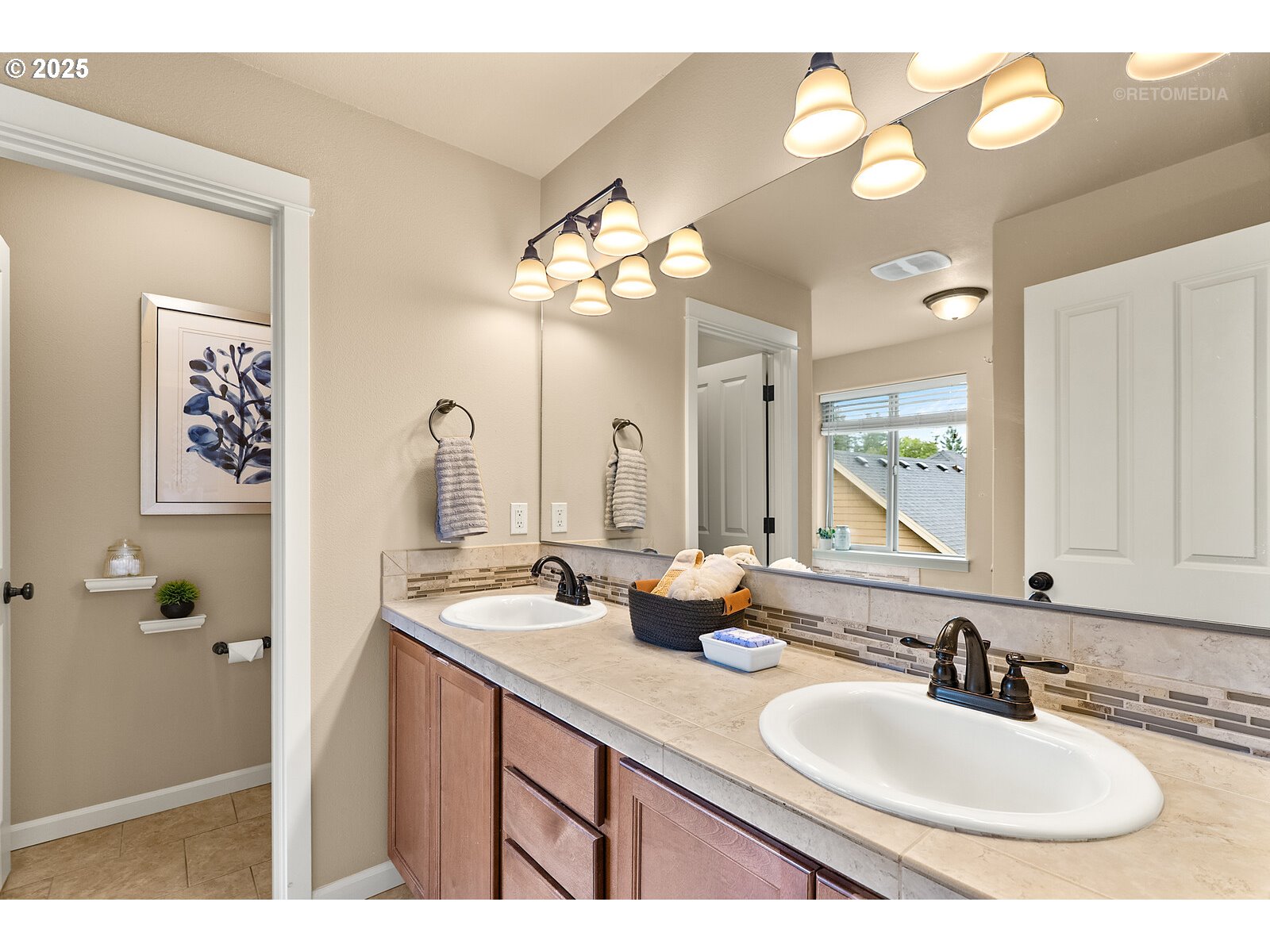865 Southwest 90th Avenue Portland, OR 97225 - Photo 21 of 36 a bathroom with a sink and a mirror