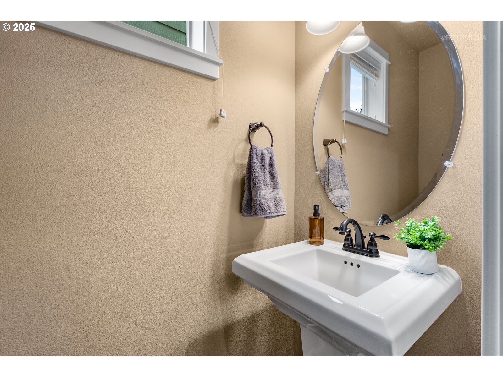 865 Southwest 90th Avenue Portland, OR 97225 - Photo 8 of 36 a bathroom with a sink and a mirror