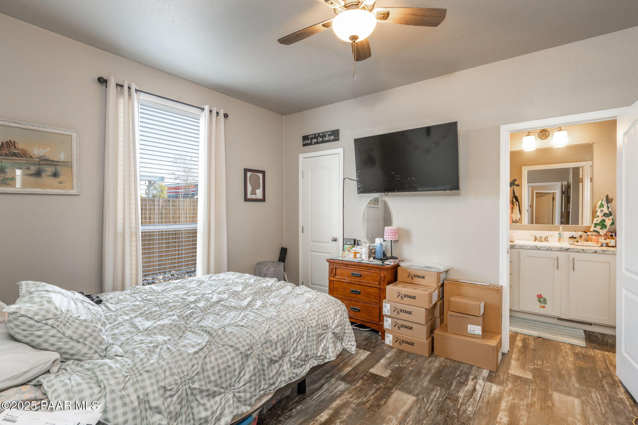 1023 Thorton Road Camp Verde, AZ 86322 - Photo 17 of 29 a bedroom with a bed and a flat screen tv