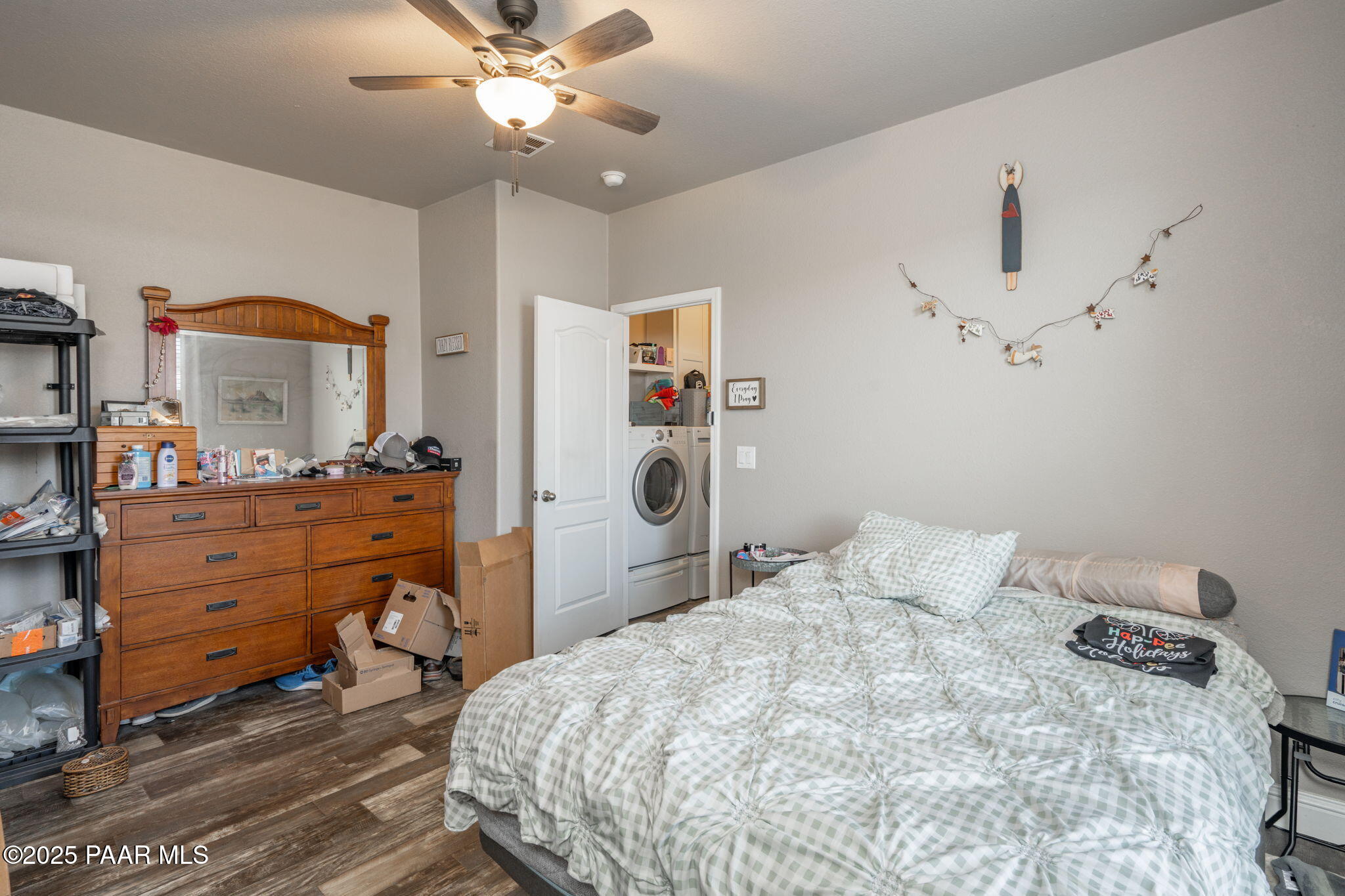 1023 Thorton Road Camp Verde, AZ 86322 - Photo 19 of 29 a bedroom with a bed and a chandelier