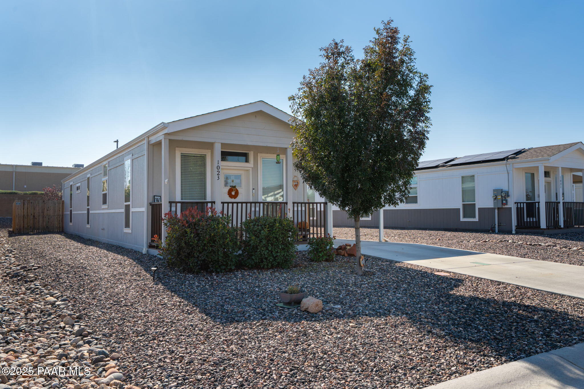 1023 Thorton Road Camp Verde, AZ 86322 - Photo 2 of 29 a front view of a house with a yard and trees