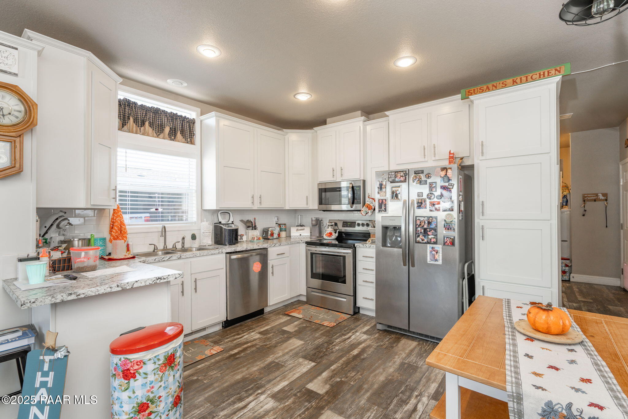 1023 Thorton Road Camp Verde, AZ 86322 - Photo 10 of 29 a kitchen with stainless steel appliances granite countertop a refrigerator a stove top oven a sink and dishwasher