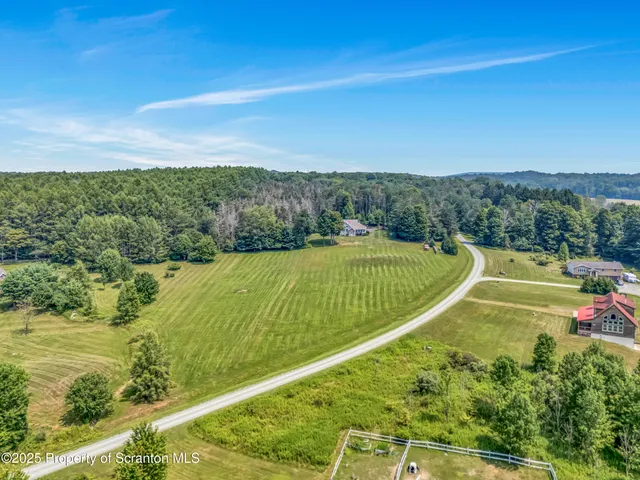 a view of a town with mountains in the background
