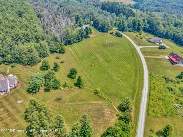 a kitchen with a stove a sink a dining table and chairs