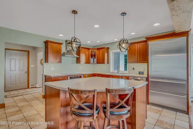 a living room with furniture a rug and a fireplace