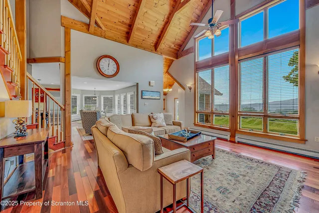 a view of empty room with wooden walls