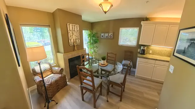 a dining room with furniture and window