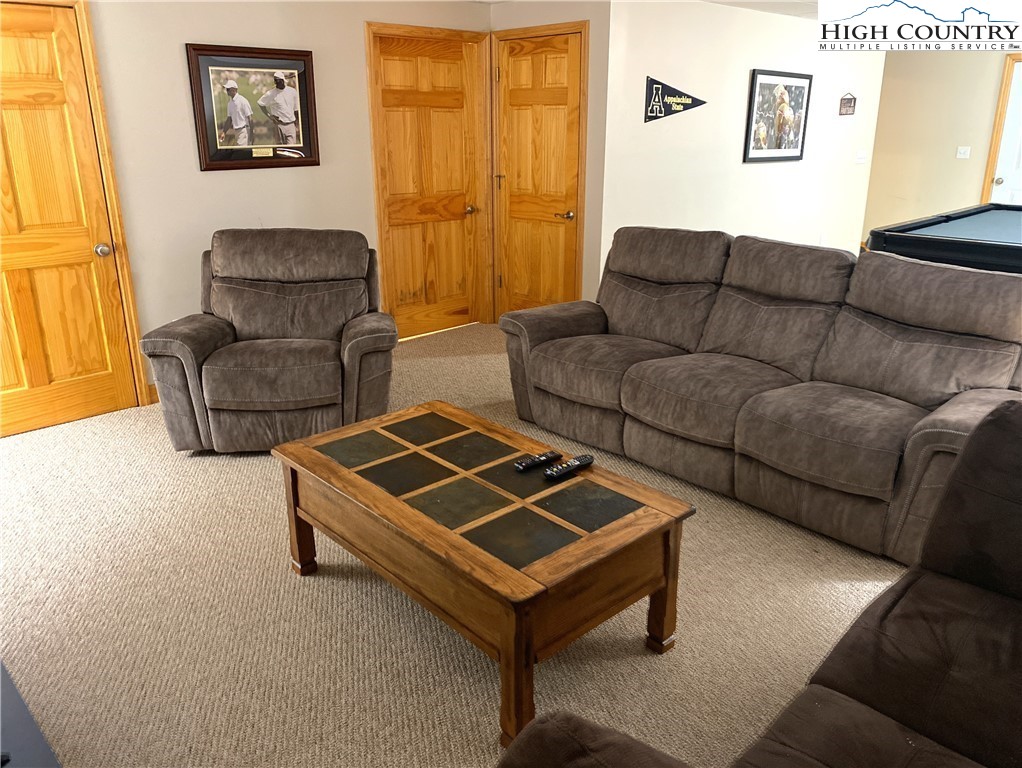 402 Pinnacle Ridge Road Beech Mountain, NC 28604 - Photo 33 of 44 a living room with furniture and a window