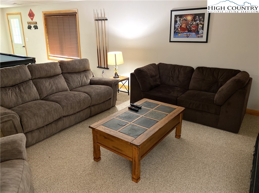 402 Pinnacle Ridge Road Beech Mountain, NC 28604 - Photo 34 of 44 a living room with furniture and a couch