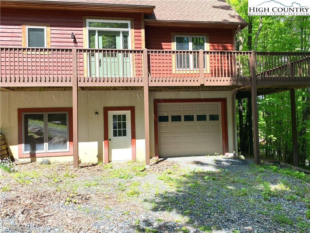 402 Pinnacle Ridge Road Beech Mountain, NC 28604 - Photo 42 of 44 a front view of a house with a yard