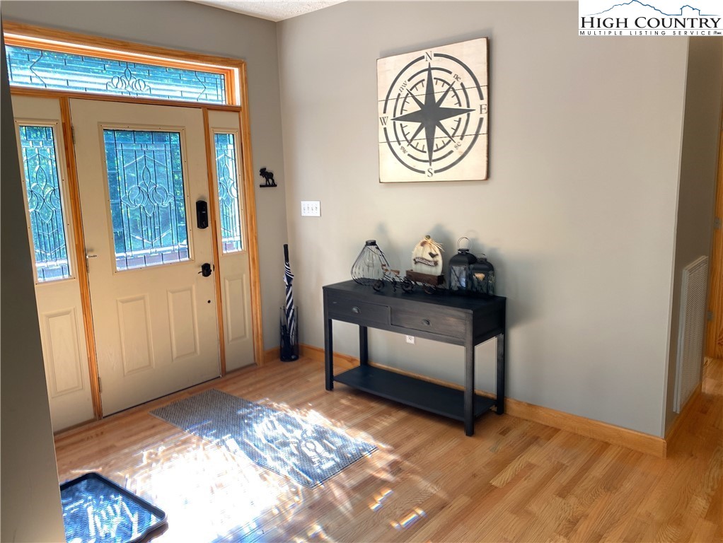 402 Pinnacle Ridge Road Beech Mountain, NC 28604 - Photo 8 of 44 a bedroom with a bed and a window