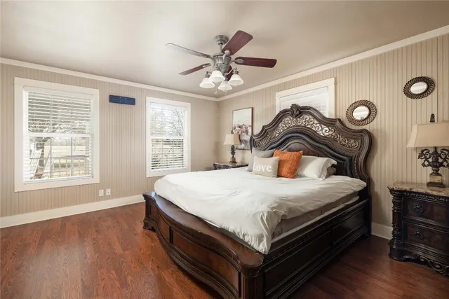 a bedroom with a bed and window