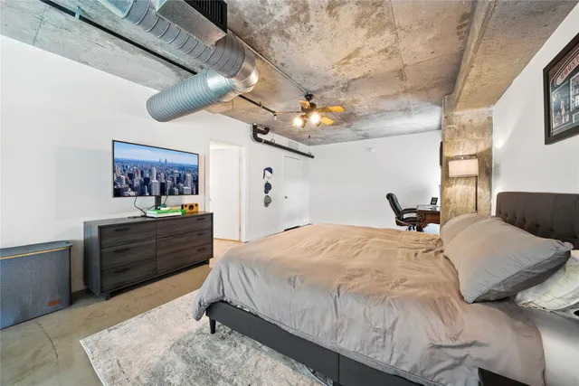 a bathroom with a sink vanity mirror and toilet