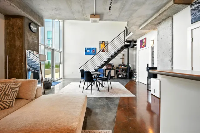a dining room with furniture entryway and wooden floor