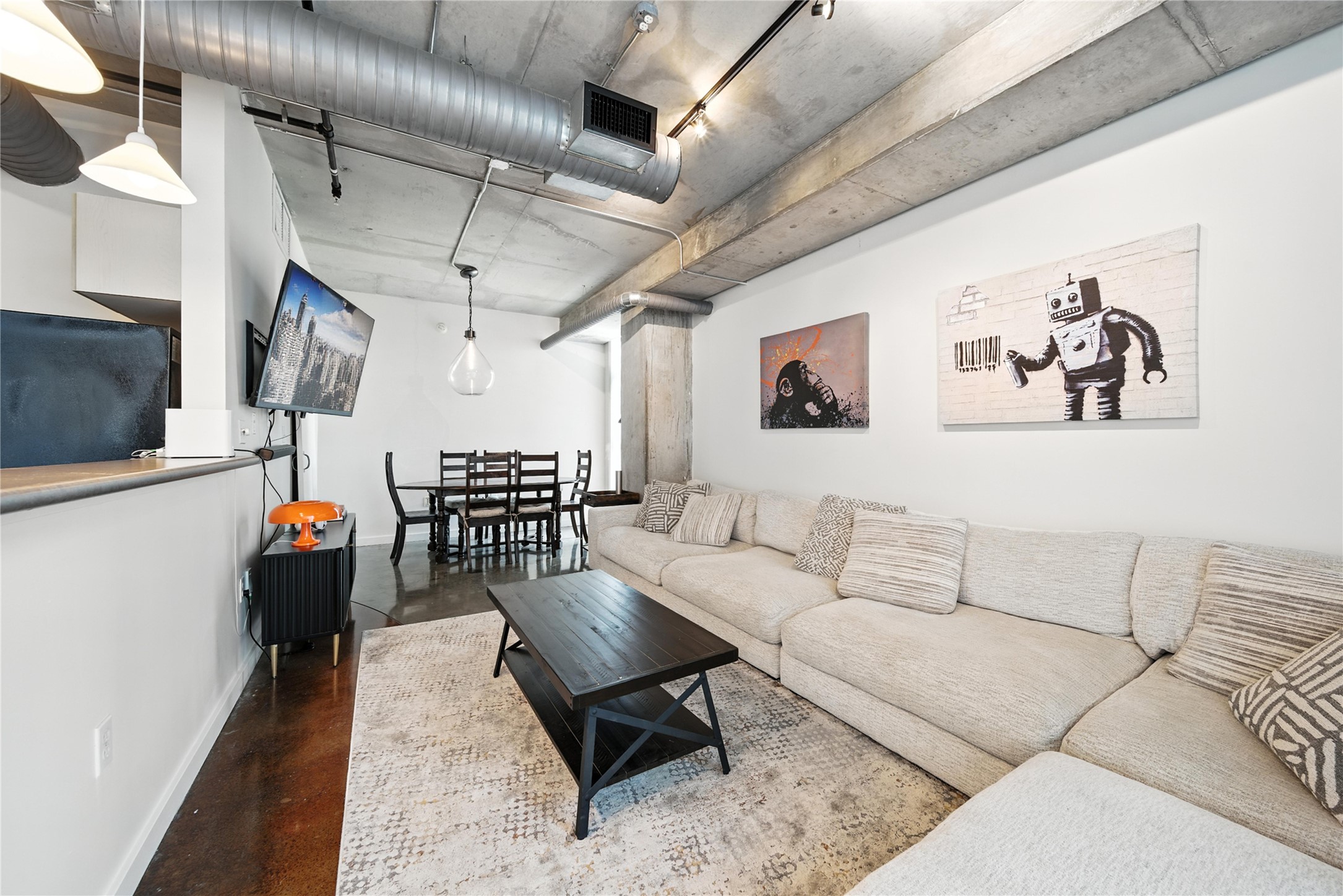 2000 Bagby Street, Unit 5423 Houston, TX 77002 - Photo 6 of 26 a living room with furniture and wooden walls