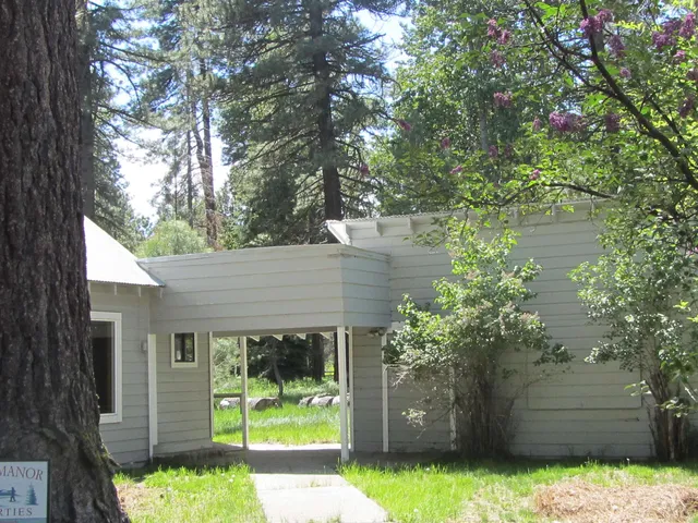 a kitchen with a sink and a large window