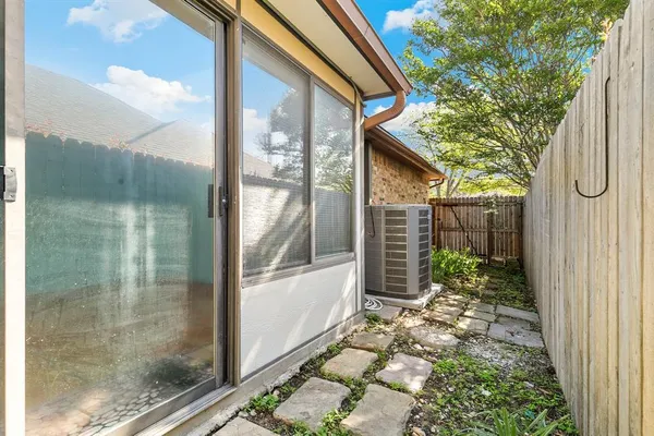 a view of a glass door with a yard