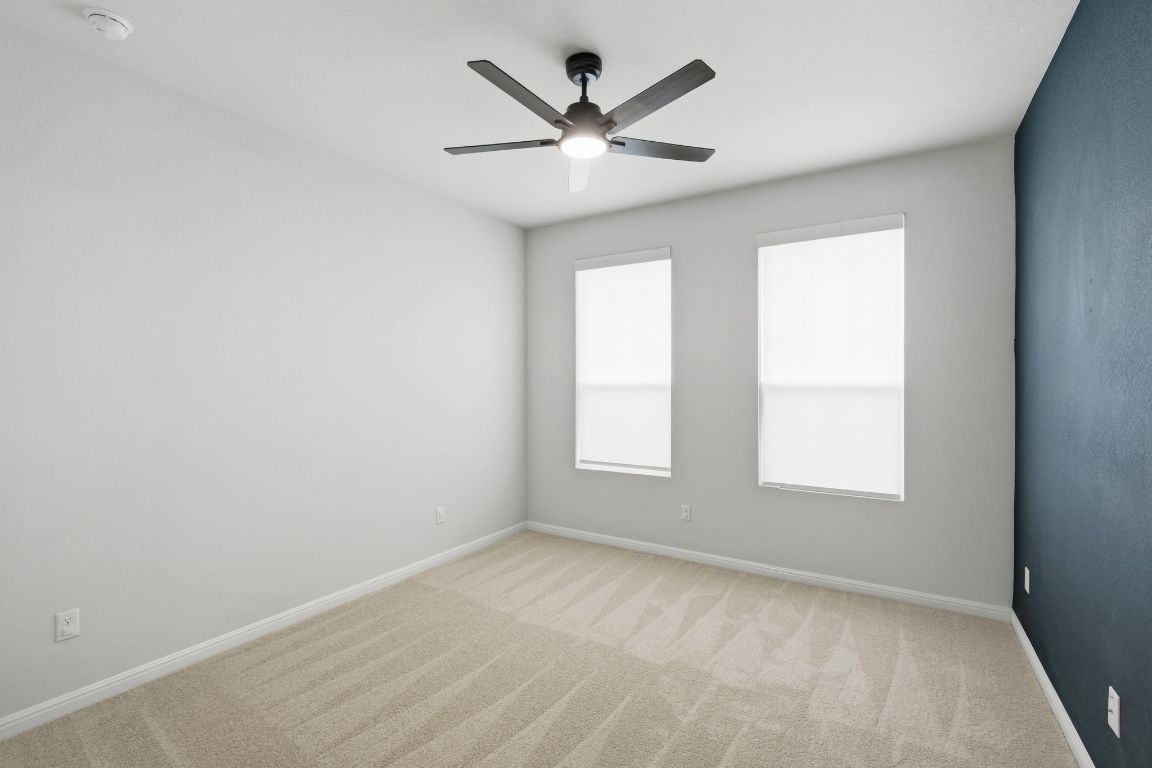 1941 Winston Way Leander, TX 78641 - Photo 10 of 28 Spare room featuring carpet and ceiling fan