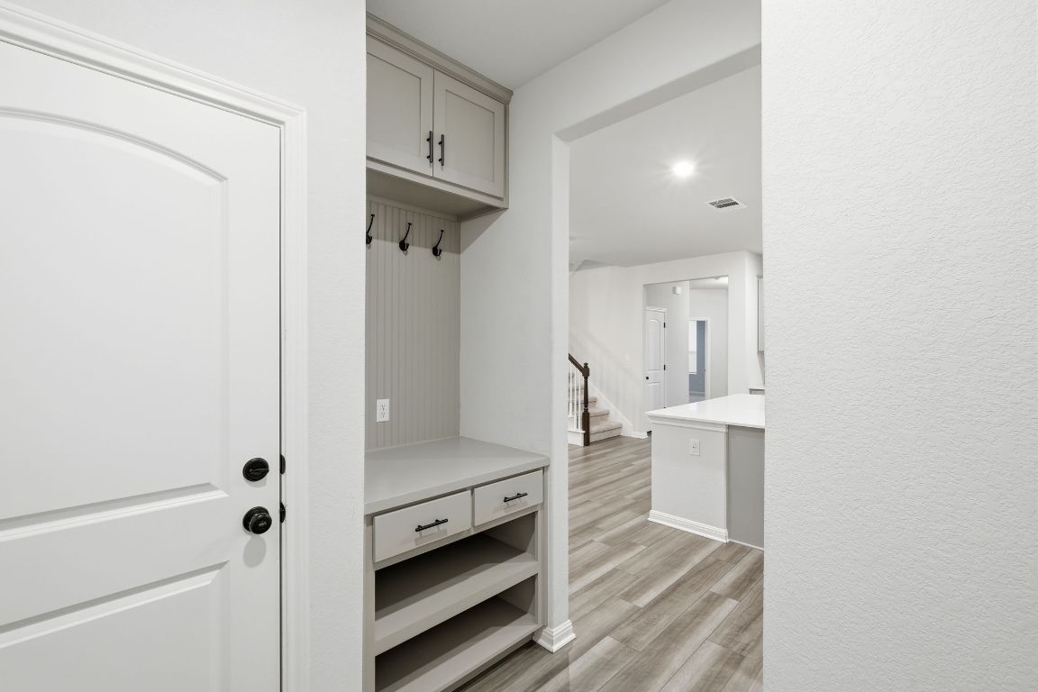 1941 Winston Way Leander, TX 78641 - Photo 9 of 28 Mudroom featuring light wood finished floors and recessed lighting