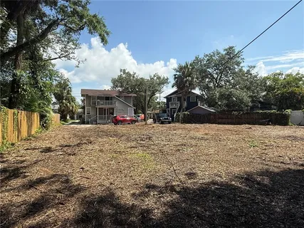 a view of outdoor space with garden and trees