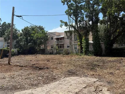 a pathway of a house with a yard
