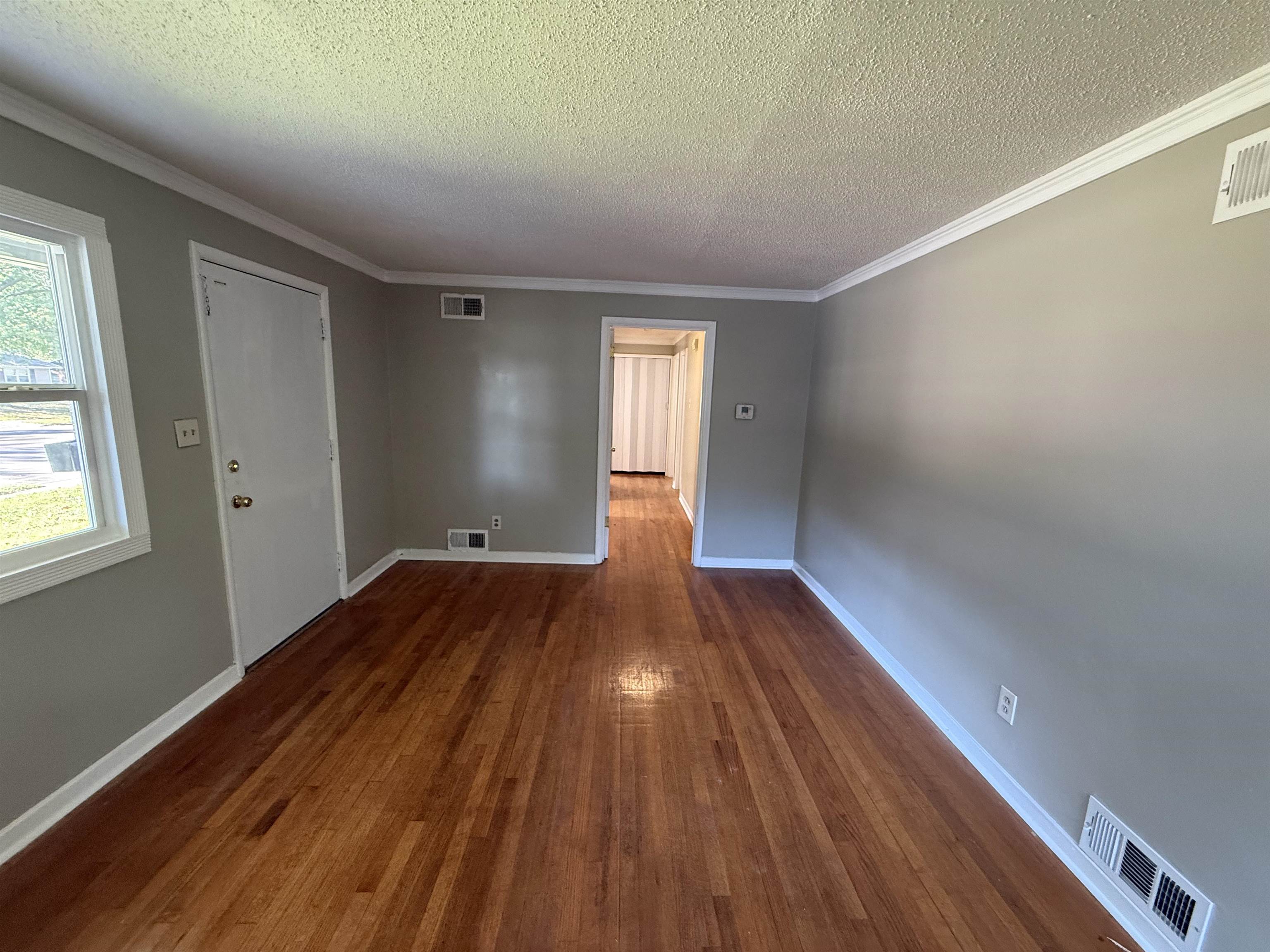 1232 South White Station Road Memphis, TN 38117 - Photo 4 of 21 a view of empty room with wooden floor