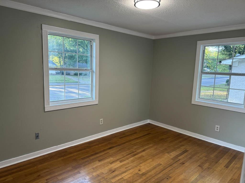 1232 South White Station Road Memphis, TN 38117 - Photo 8 of 21 a view of a room with wooden floor and windows