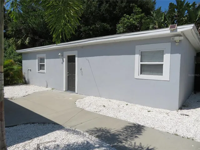 a view of a backyard of a house