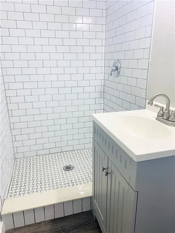 a white toilet sitting next to a small bathroom