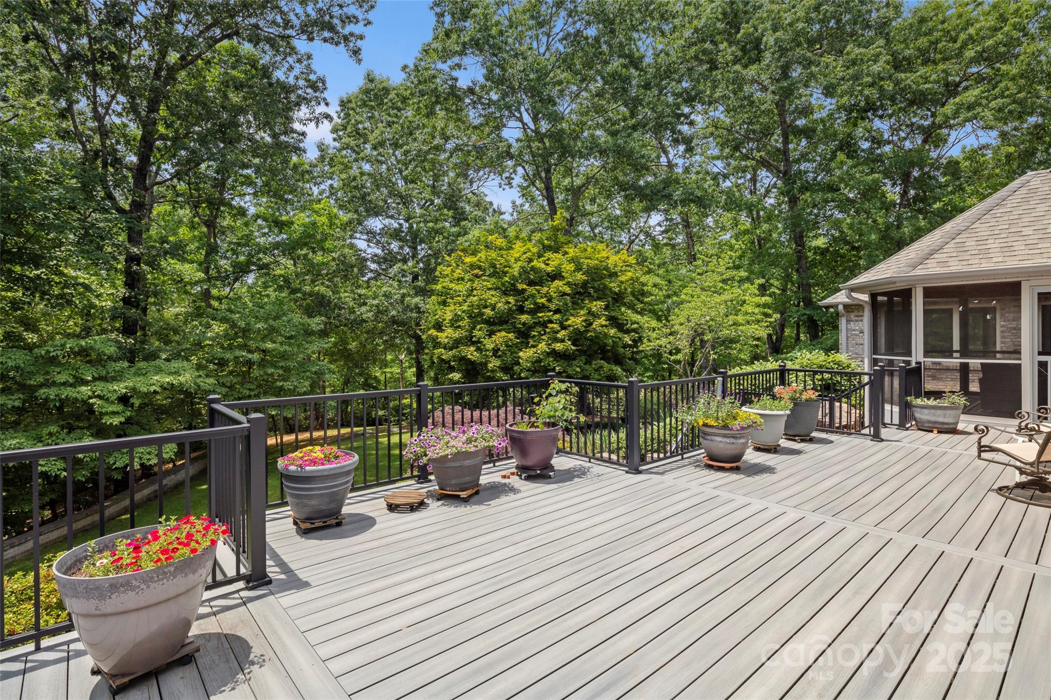 421 North Boundary Road Mill Spring, NC 28756 - Photo 12 of 43 a view of a patio with couches chairs and potted plants