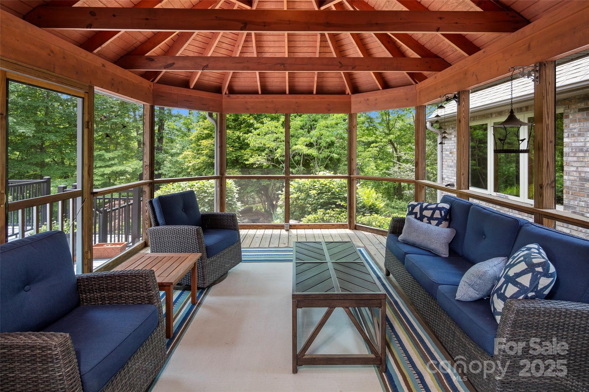 421 North Boundary Road Mill Spring, NC 28756 - Photo 16 of 43 a living room with furniture and a large window