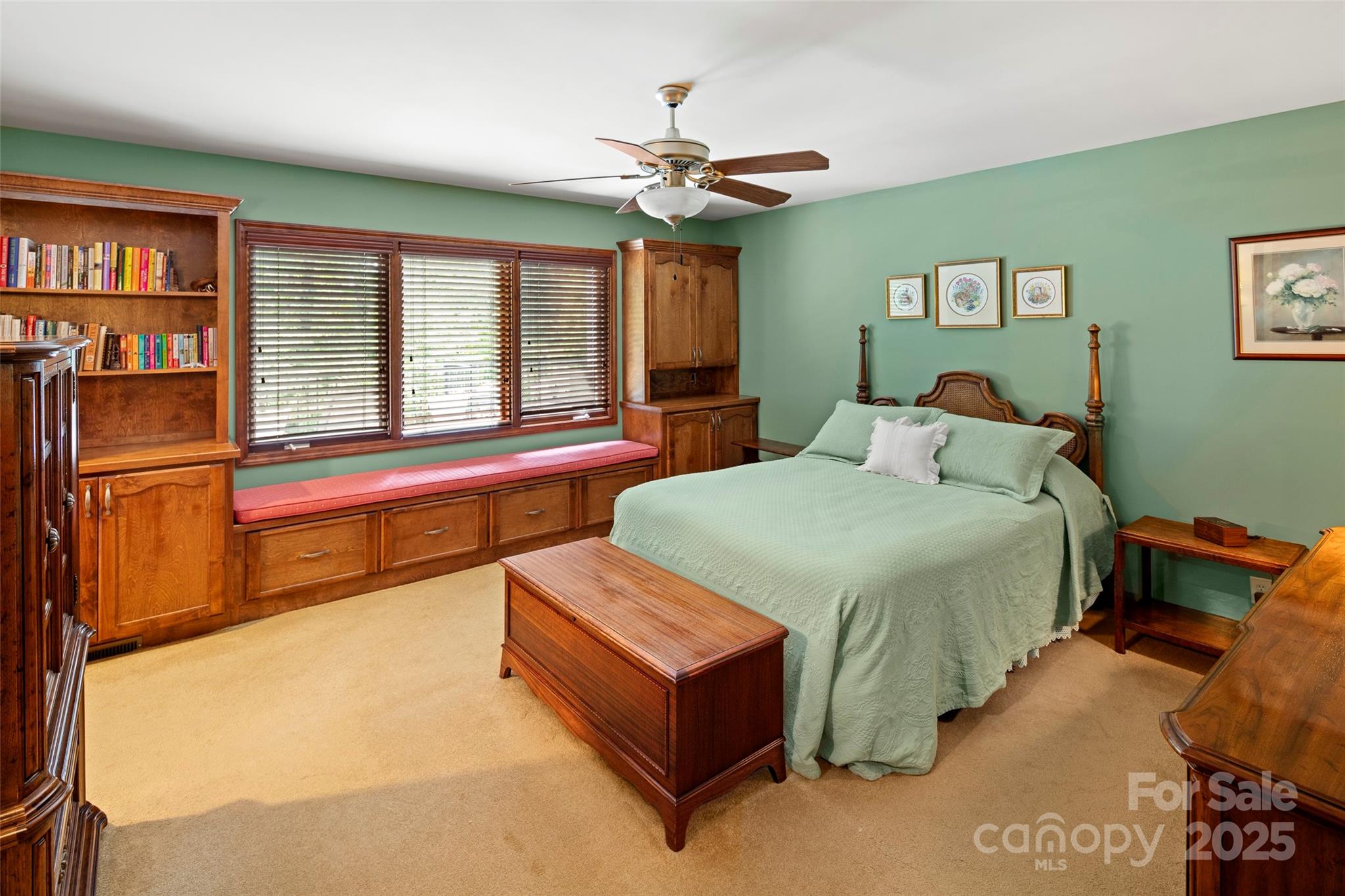 421 North Boundary Road Mill Spring, NC 28756 - Photo 19 of 43 a spacious bedroom with a bed and a chandelier
