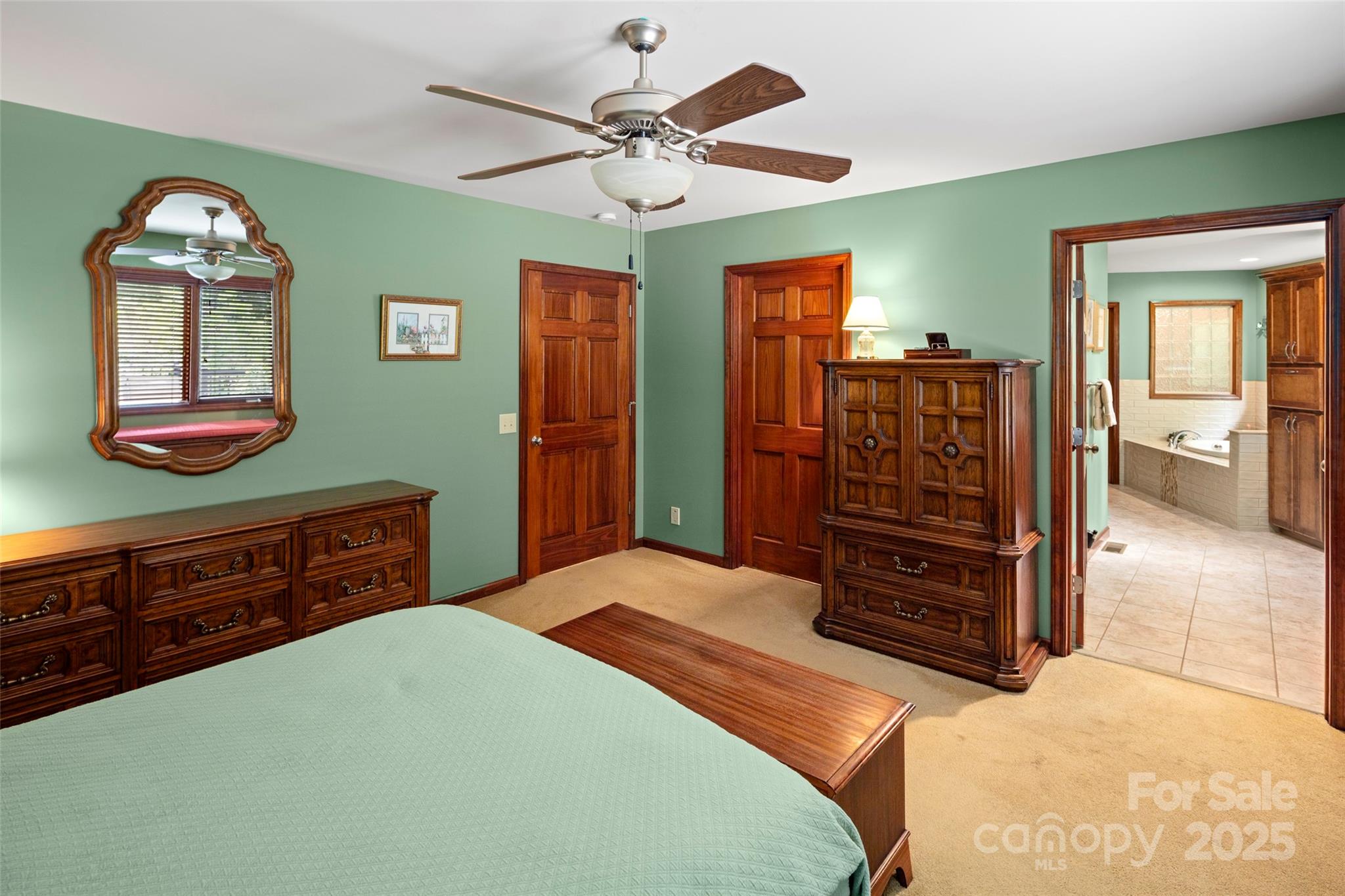 421 North Boundary Road Mill Spring, NC 28756 - Photo 20 of 43 a bedroom with a bed and a dresser