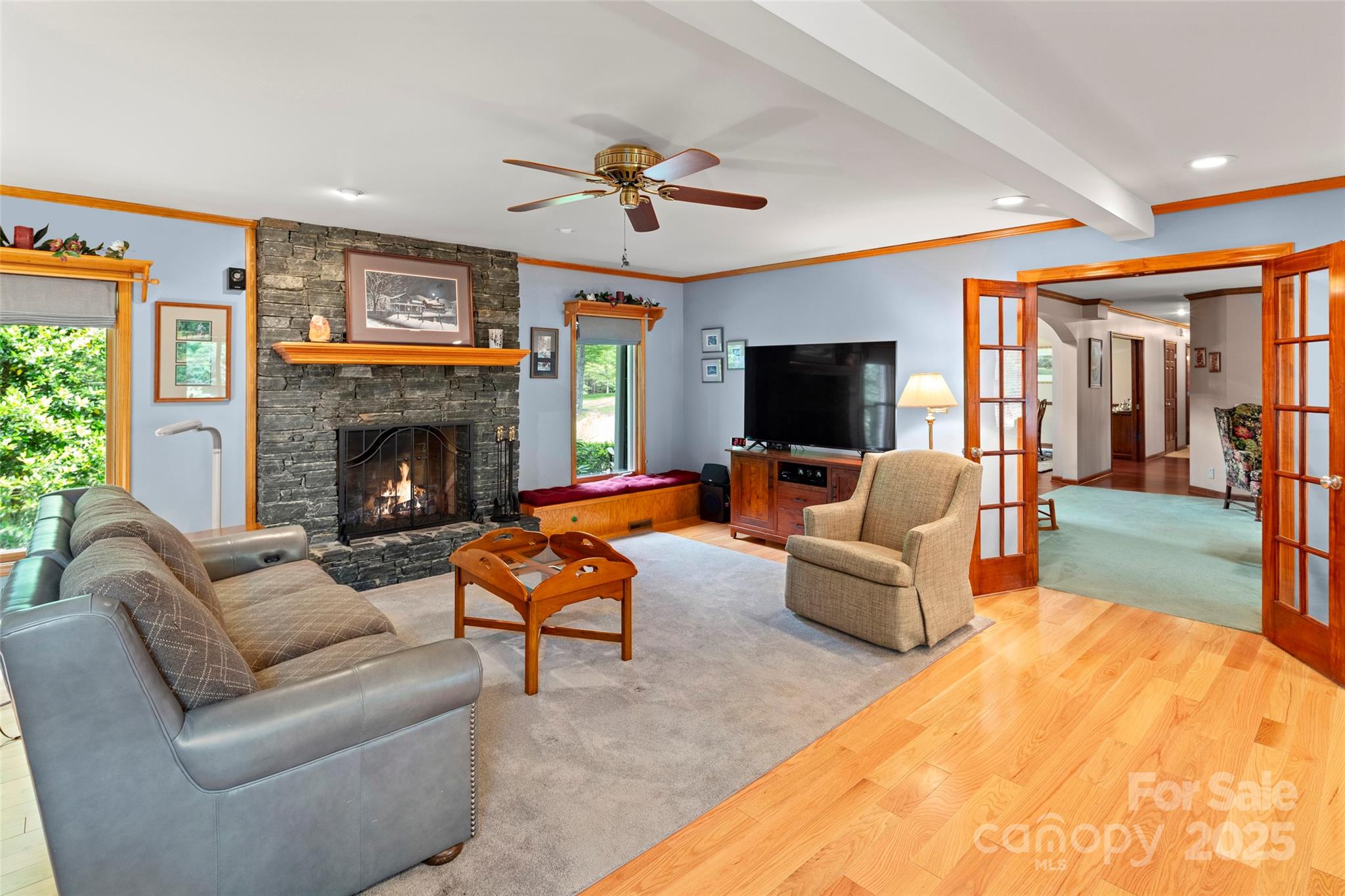 421 North Boundary Road Mill Spring, NC 28756 - Photo 22 of 43 a living room with furniture flat screen tv and a fireplace