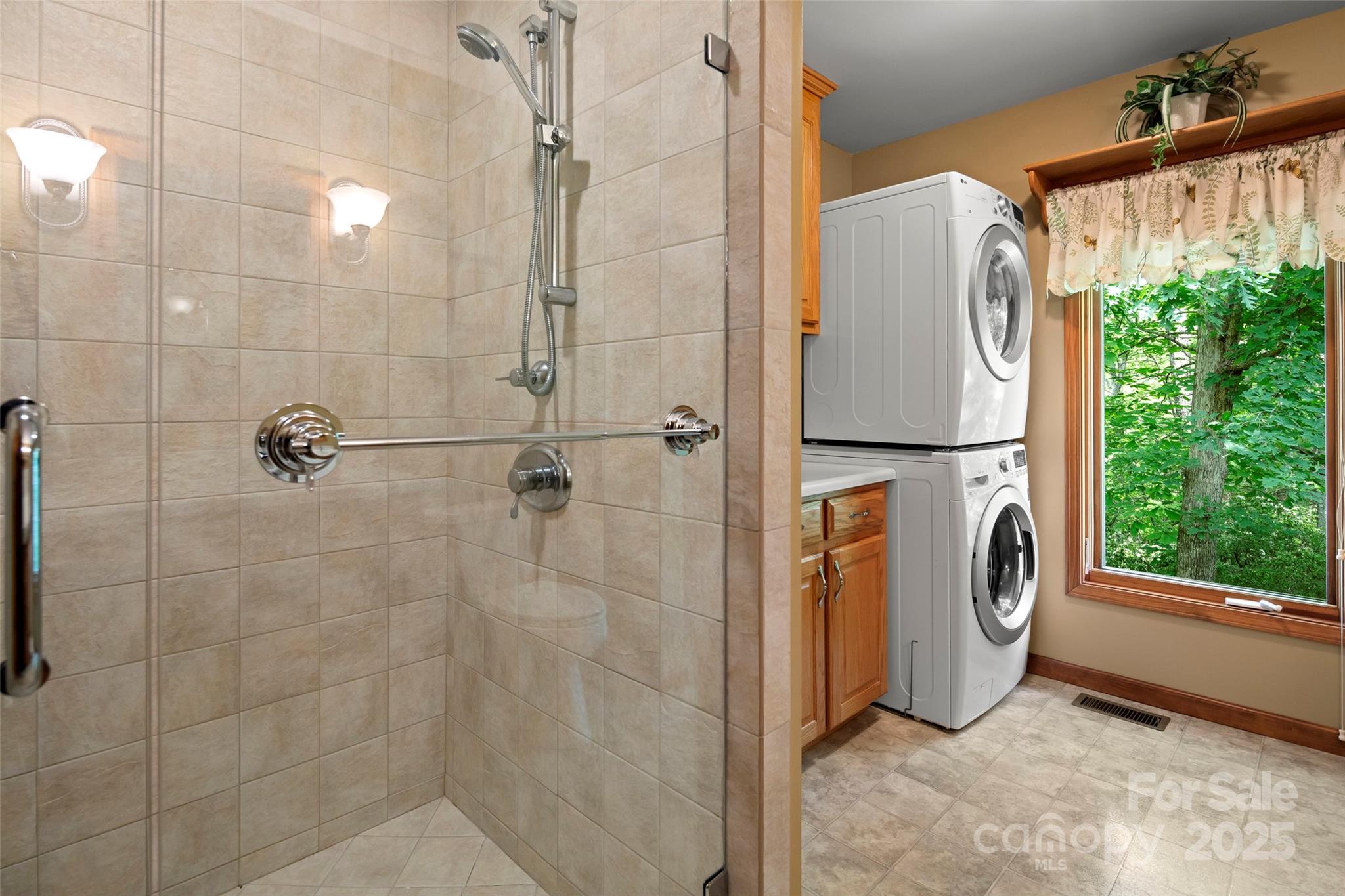 421 North Boundary Road Mill Spring, NC 28756 - Photo 27 of 43 a view of bathroom with a shower and a mirror