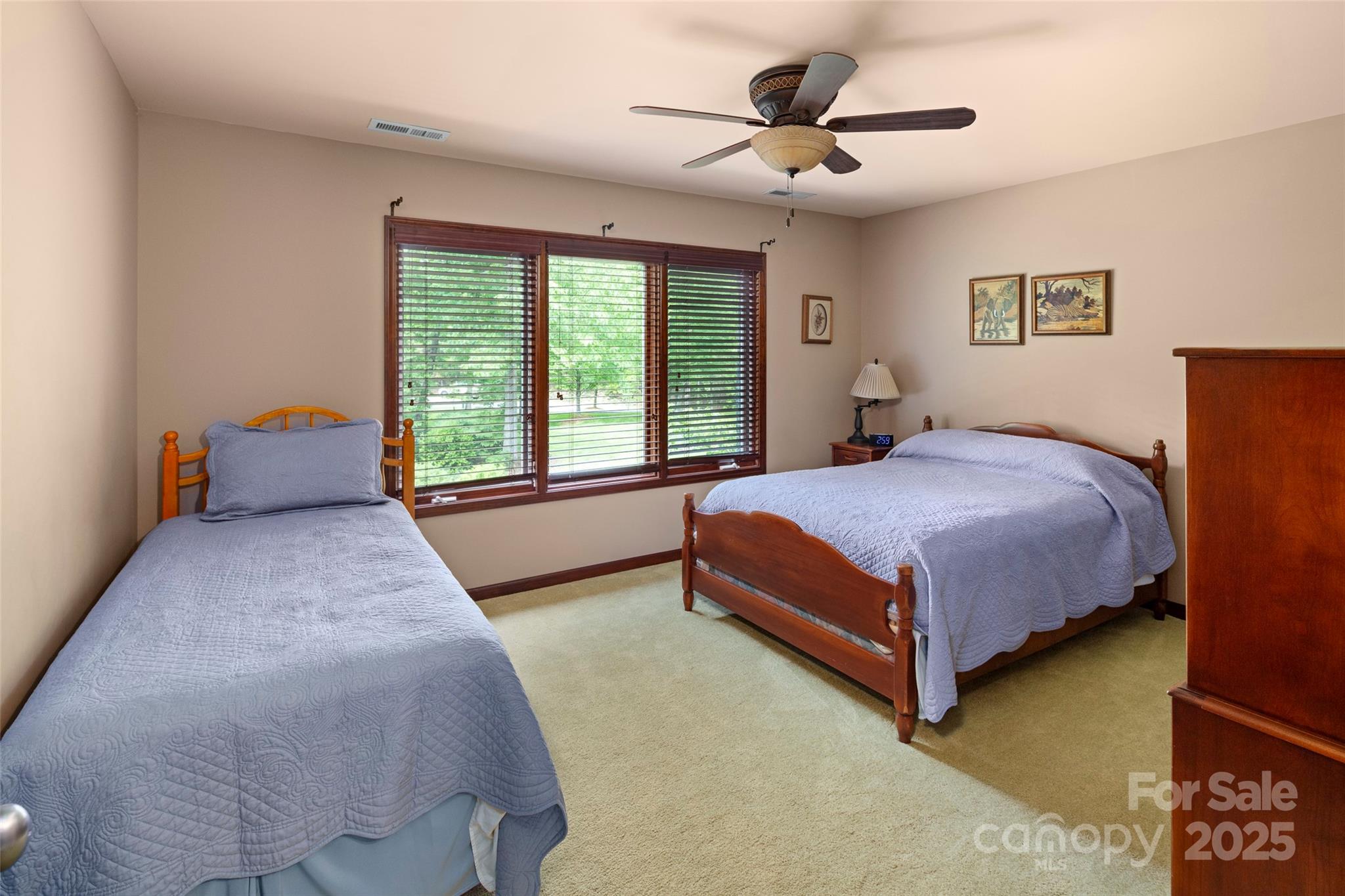 421 North Boundary Road Mill Spring, NC 28756 - Photo 29 of 43 a bedroom with a bed and a chandelier